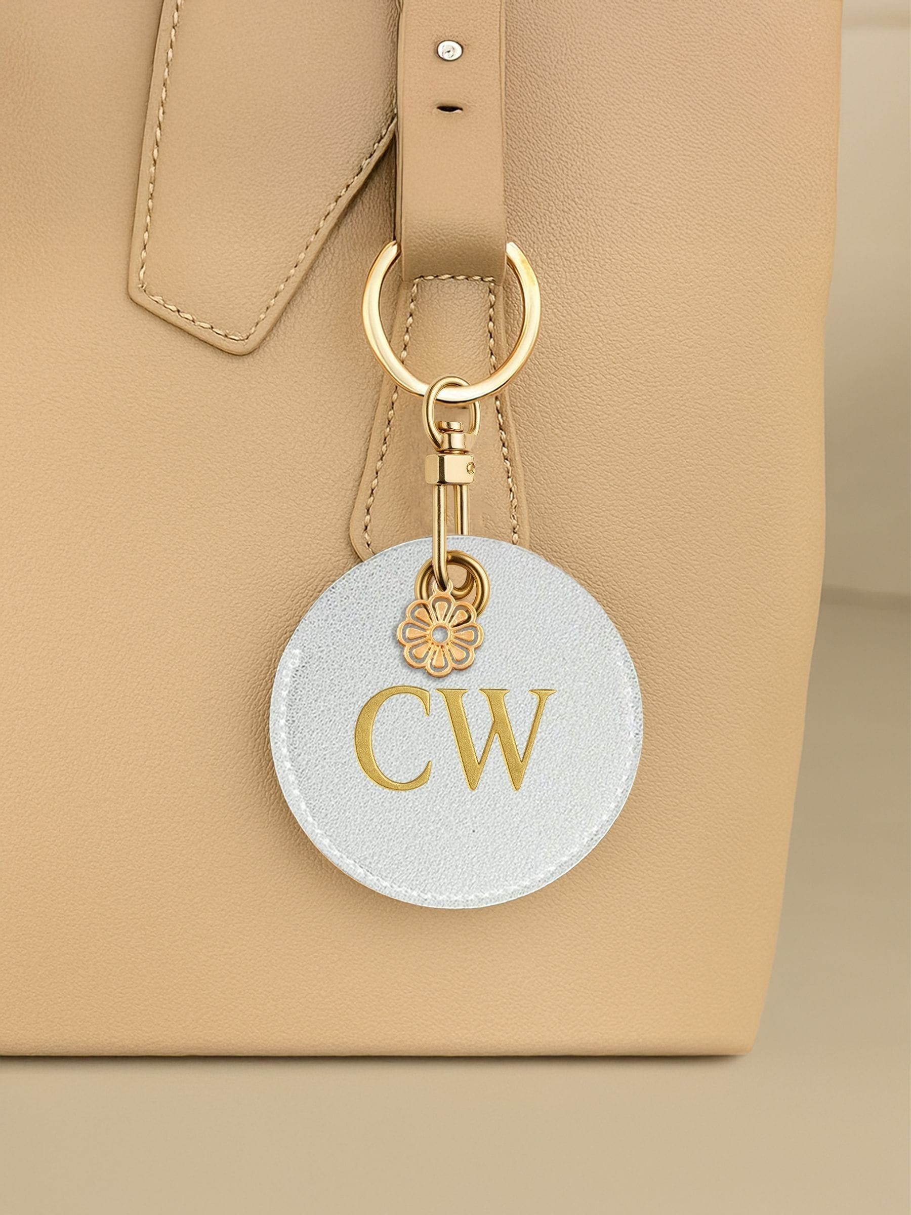 Jonnys Sister faux leather bag charm with gold tone flower, imported from the UK
