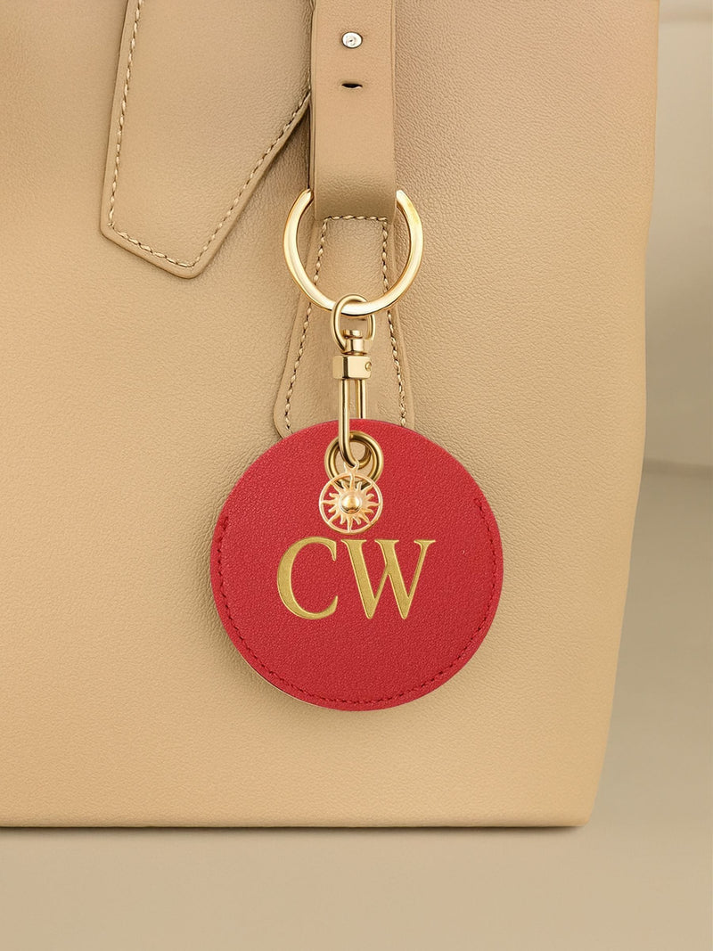 Jonnys Sister personalised faux leather bag charm with gold sun charm (British brand)
