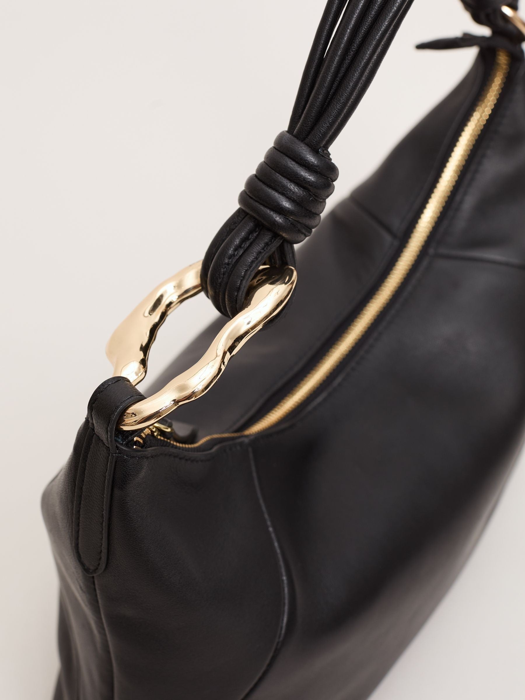Phase Eight black shoulder bag with twisted handle, UK version