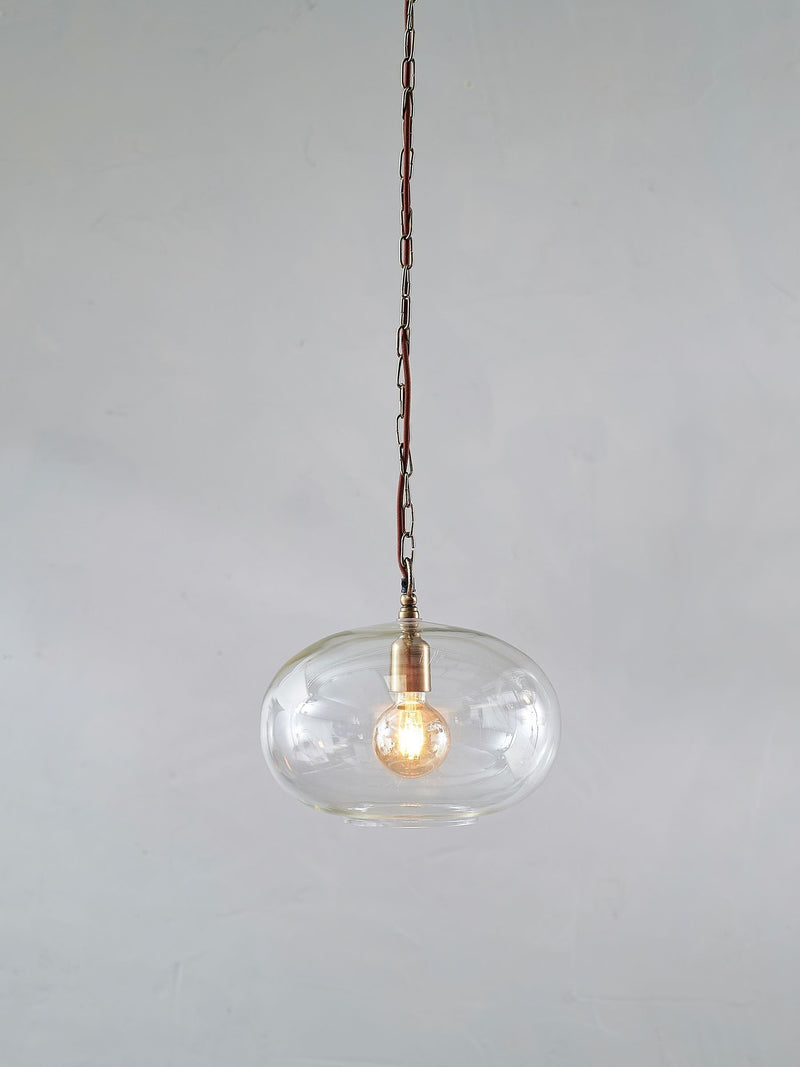 Nkuku clear glass pendant ceiling light with brass fittings - British product
