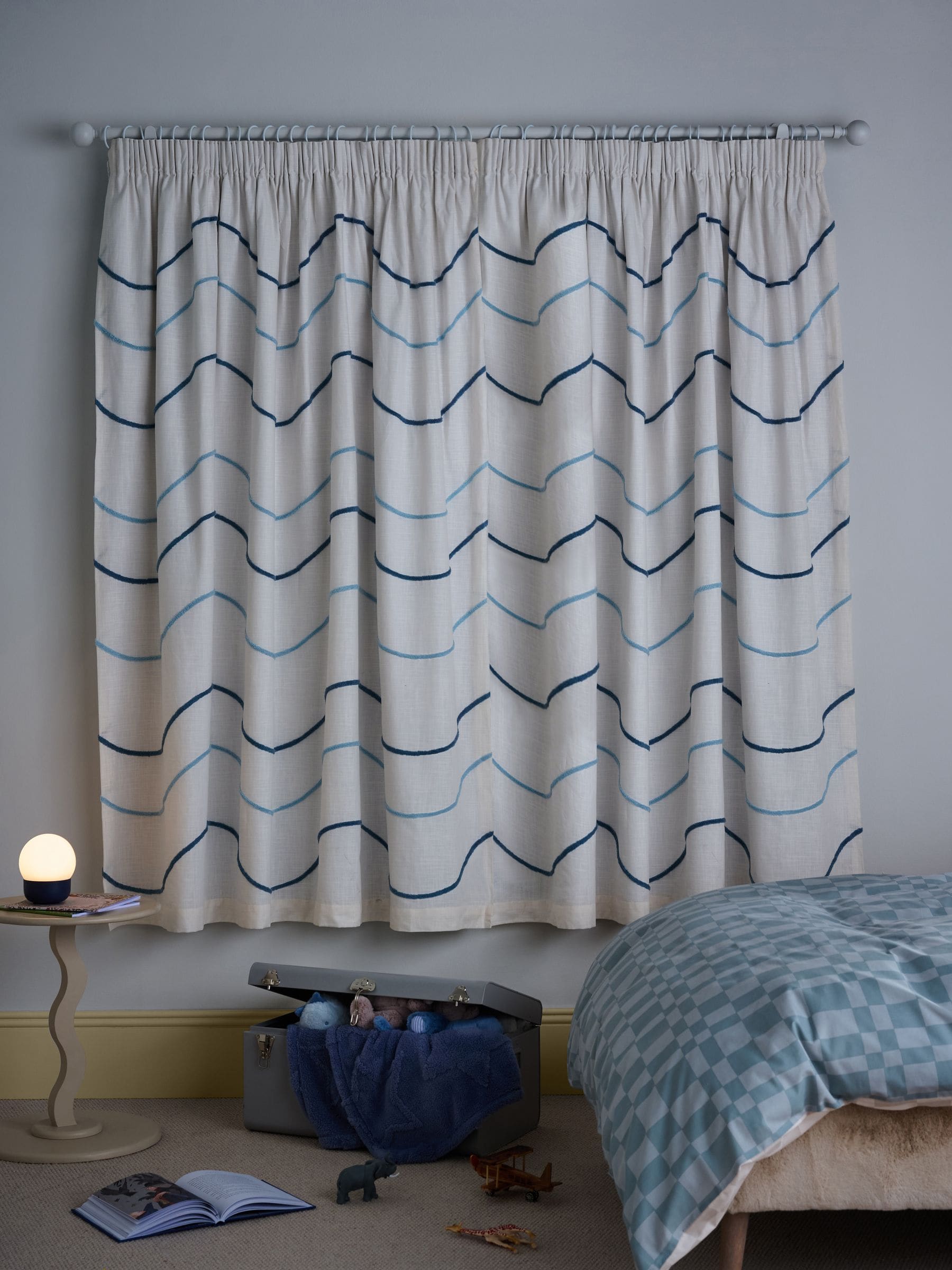 Blue tufted wiggle pencil pleat blackout curtains, imported from the UK