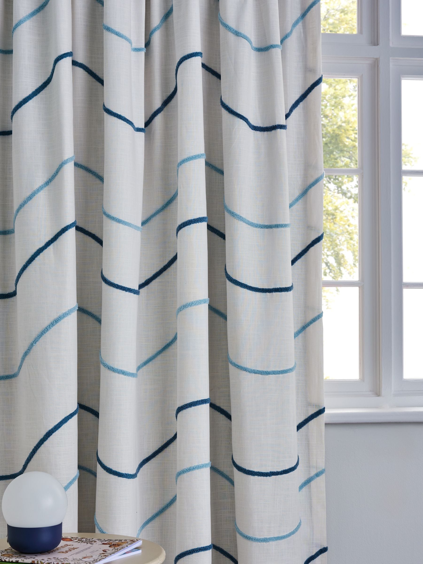 Blue tufted wiggle pencil pleat blackout curtains, imported from the UK