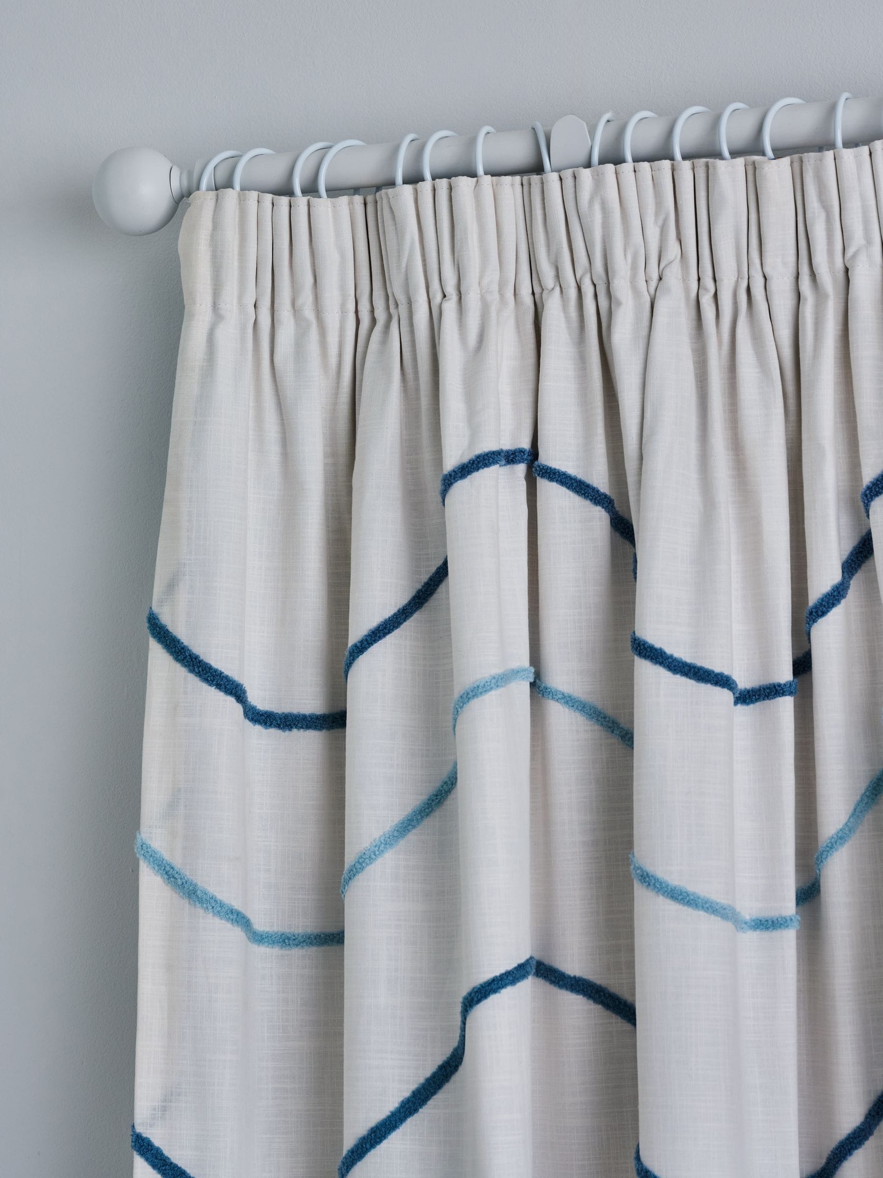 Blue tufted wiggle pencil pleat blackout curtains, imported from the UK