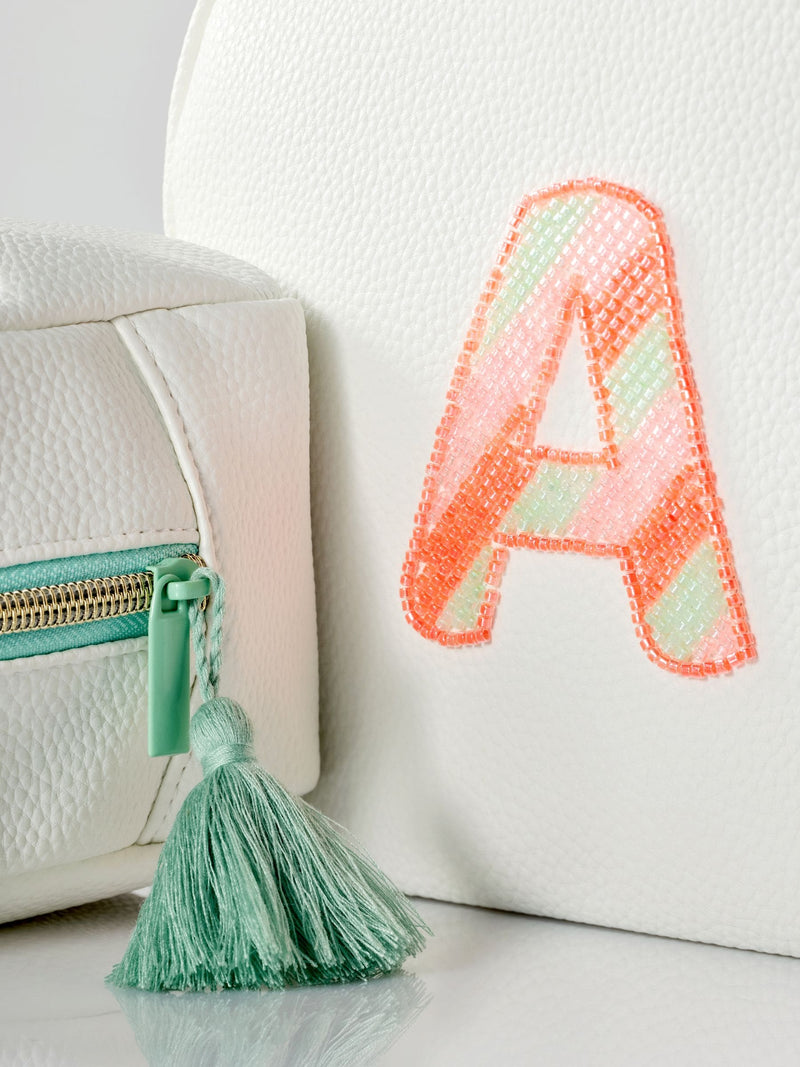 White alphabet makeup bag in soft faux leather - British product