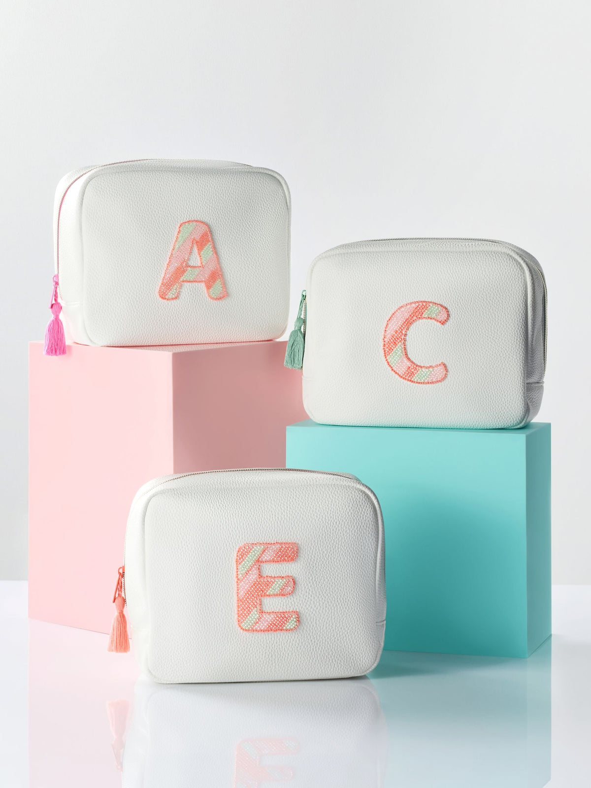 White alphabet makeup bag in soft faux leather - British product