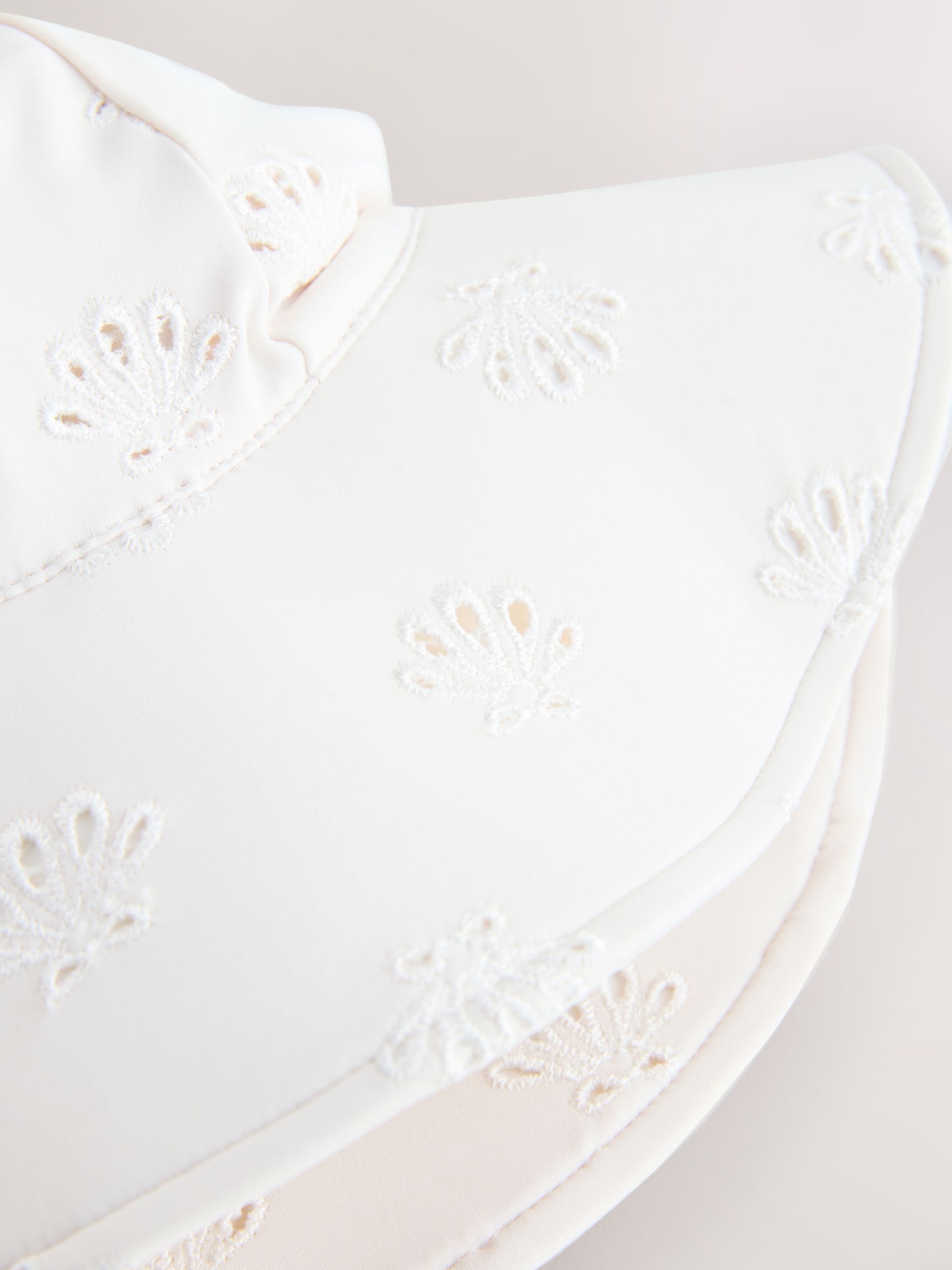 White embroidered swim hat sizes 3mths-10yrs, imported from the UK