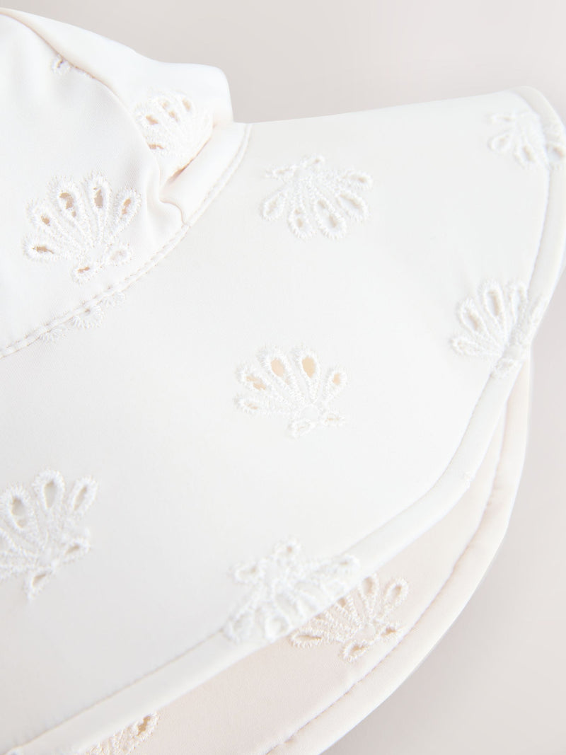 White embroidered swim hat sizes 3mths-10yrs, imported from the UK