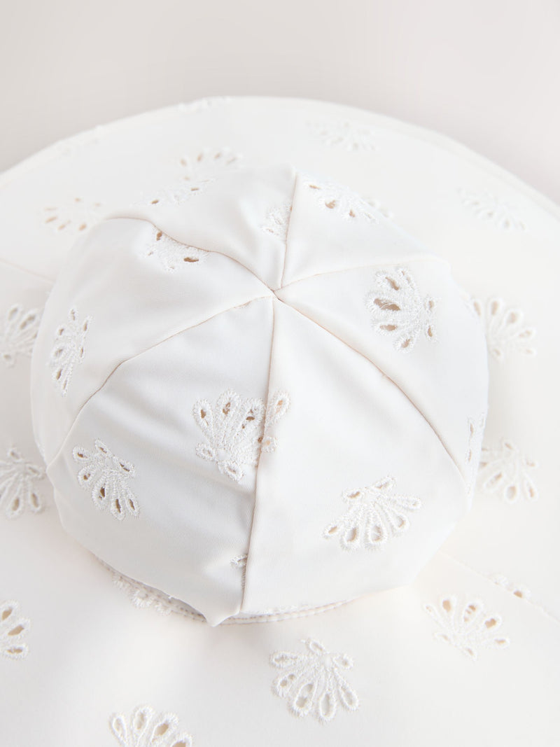White embroidered swim hat sizes 3mths-10yrs, imported from the UK
