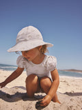 White embroidered swim hat sizes 3mths-10yrs, imported from the UK