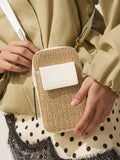 Raffia-effect phone bag with zip closure and adjustable strap, UK version