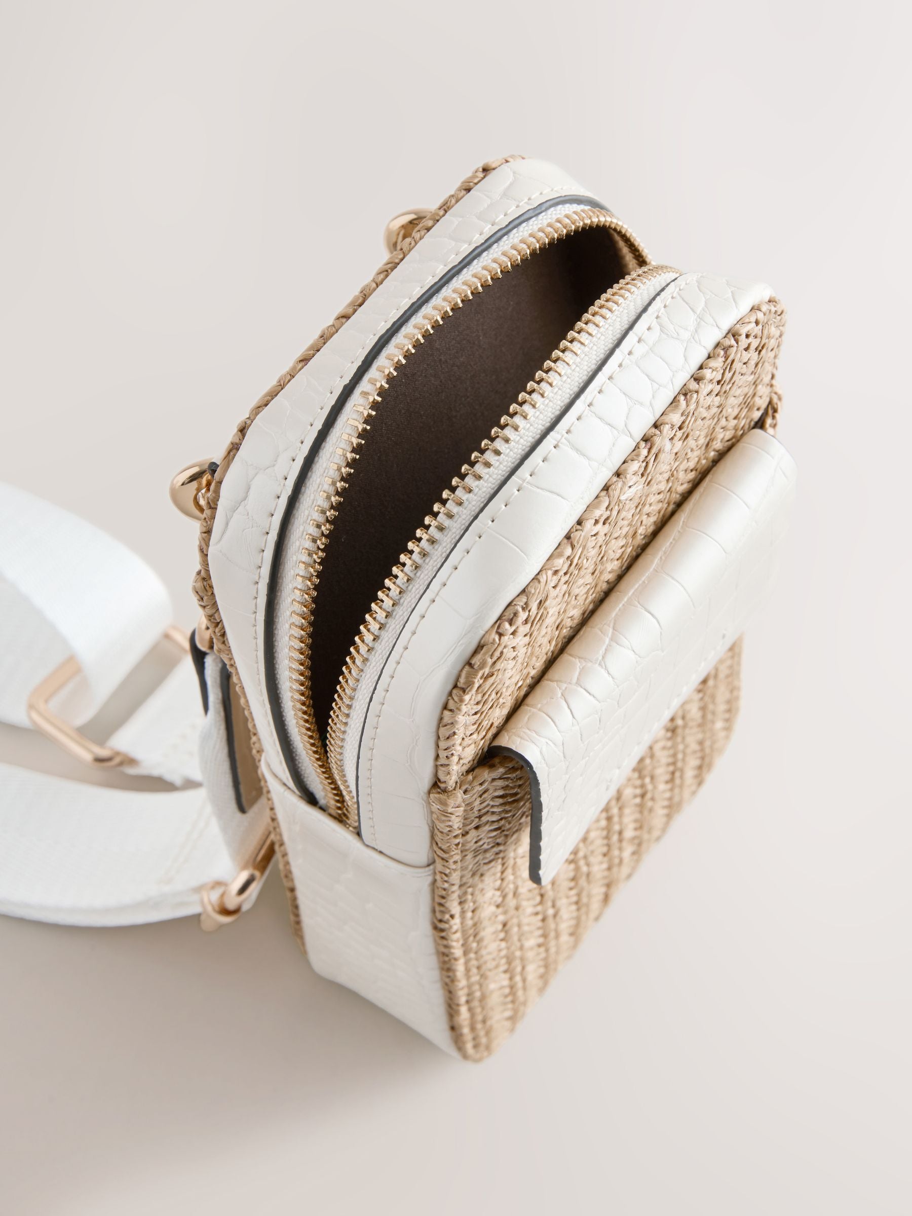 Raffia-effect phone bag with zip closure and adjustable strap, UK version