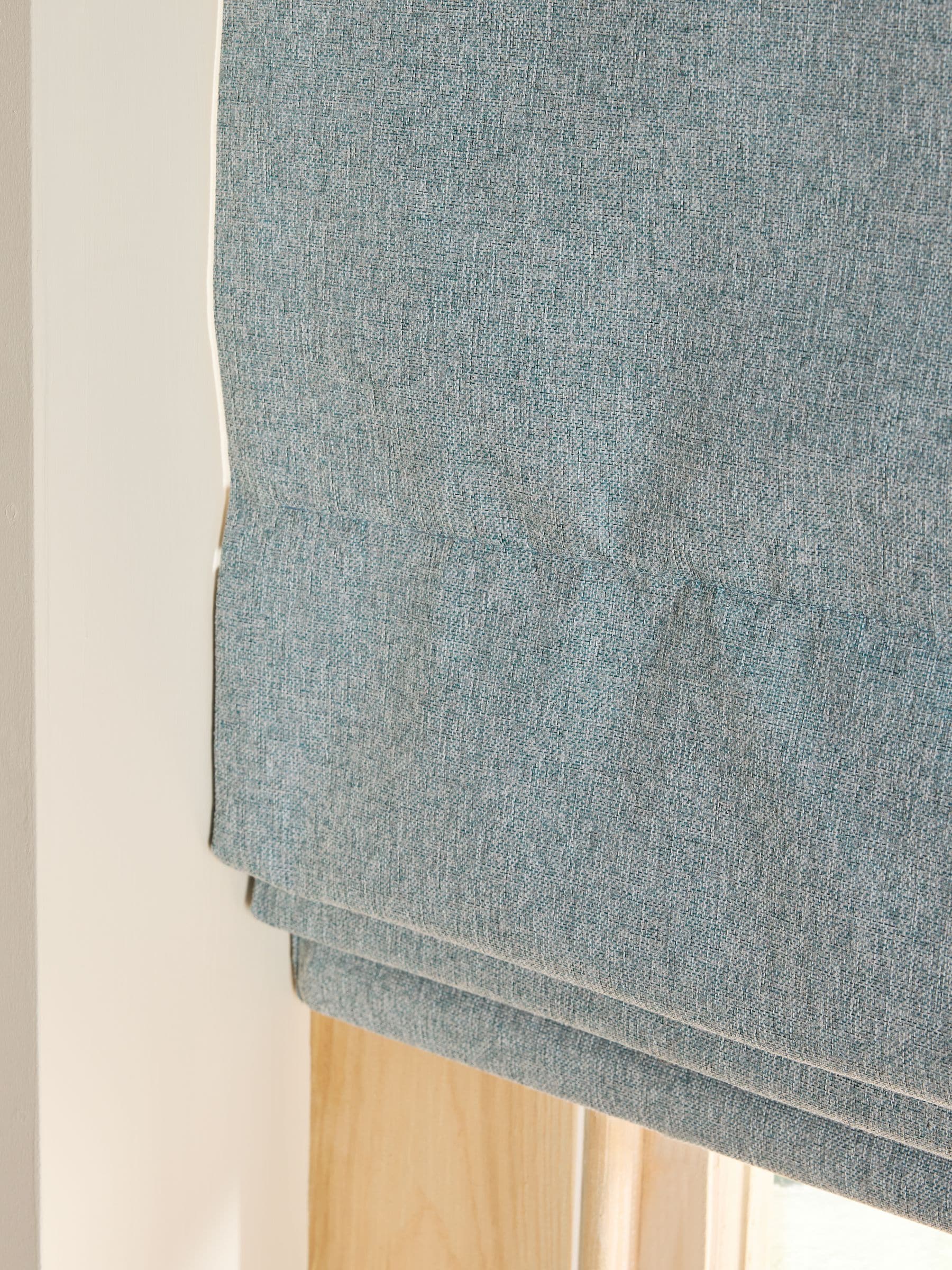 Blue soft marl Roman blind with blackout and thermal lining, imported from the UK