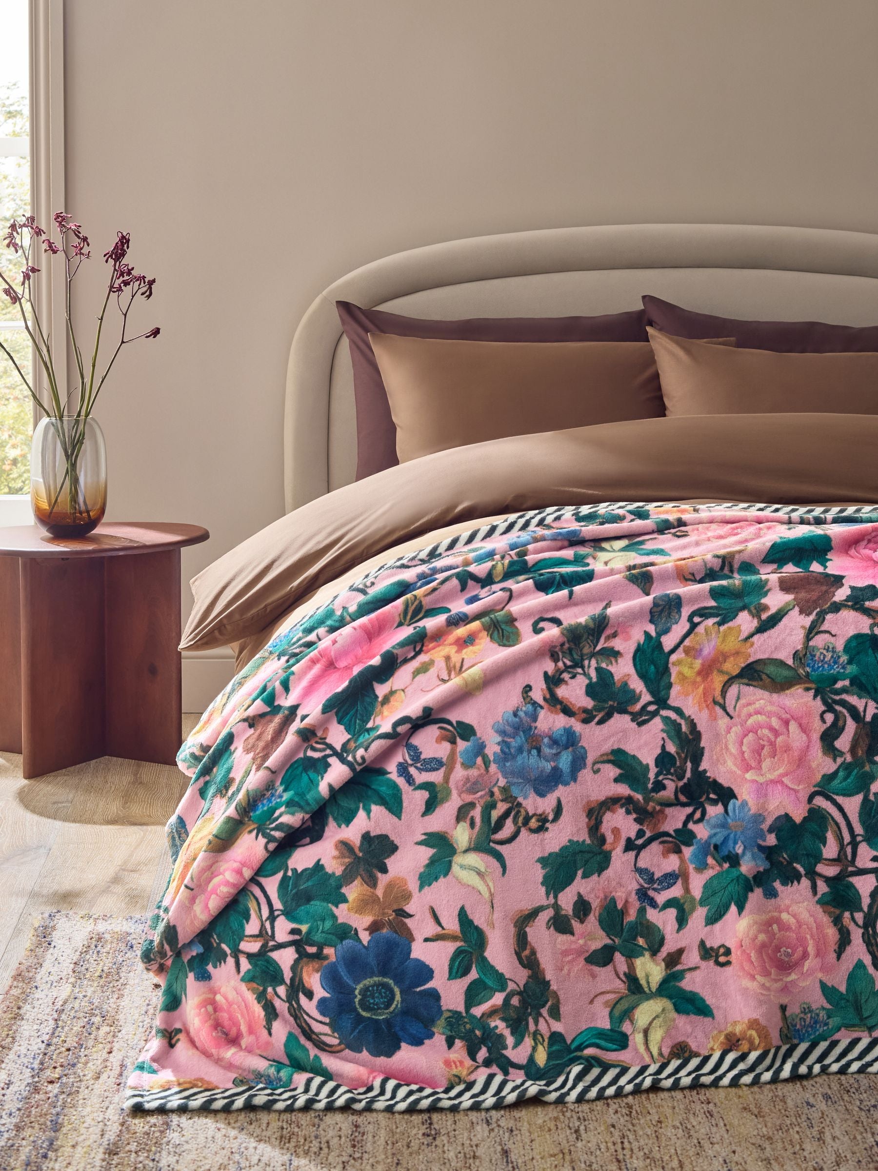 Pink floral fleece throw made from recycled polyester, imported from the UK