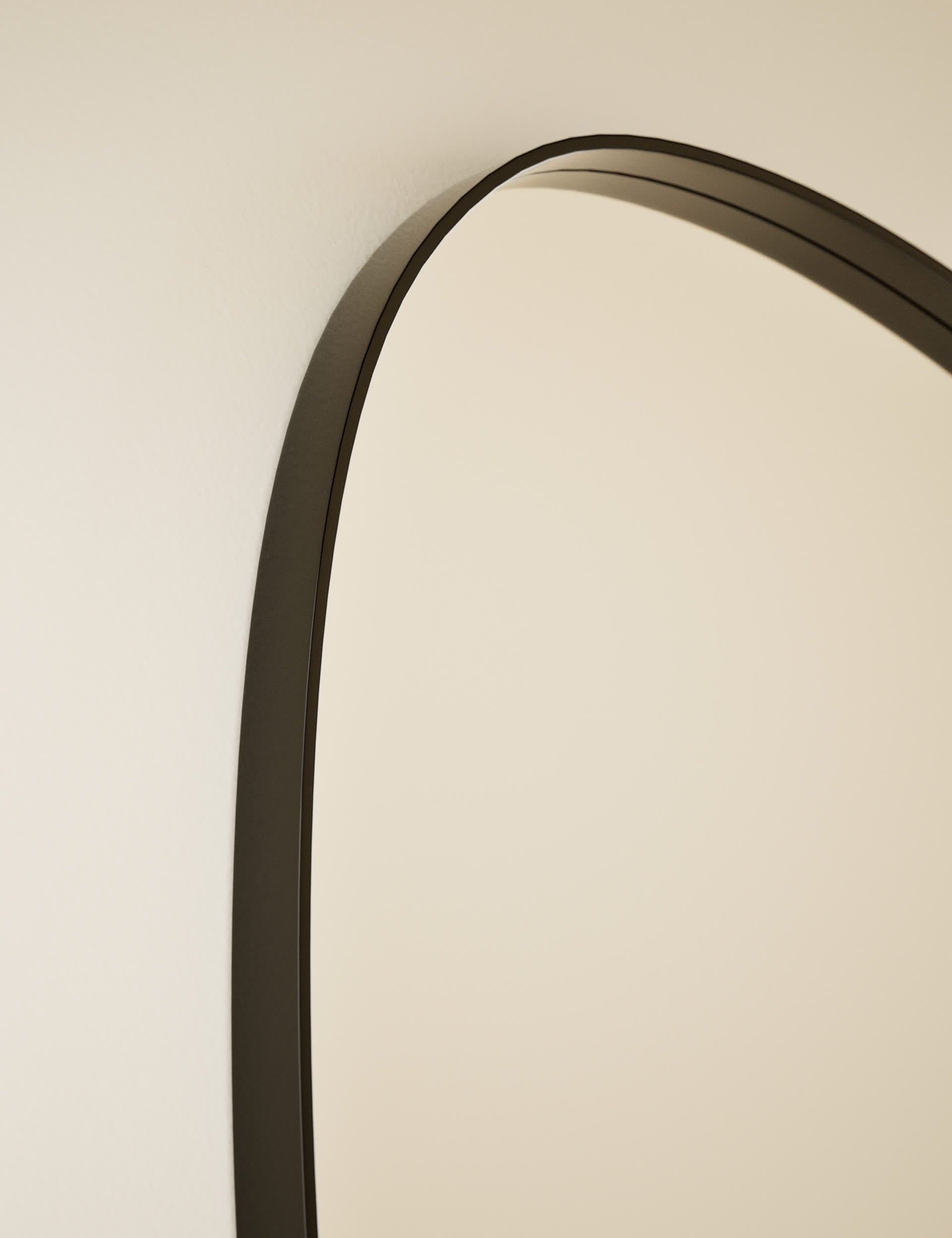 Pebble metal curved wall mirror, imported from the UK