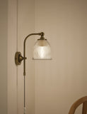 Ribbed plug in wall light with antique brass finish, imported from the UK