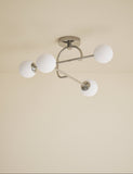 Parker flush ceiling light with metal frame and glass shades, imported from the UK