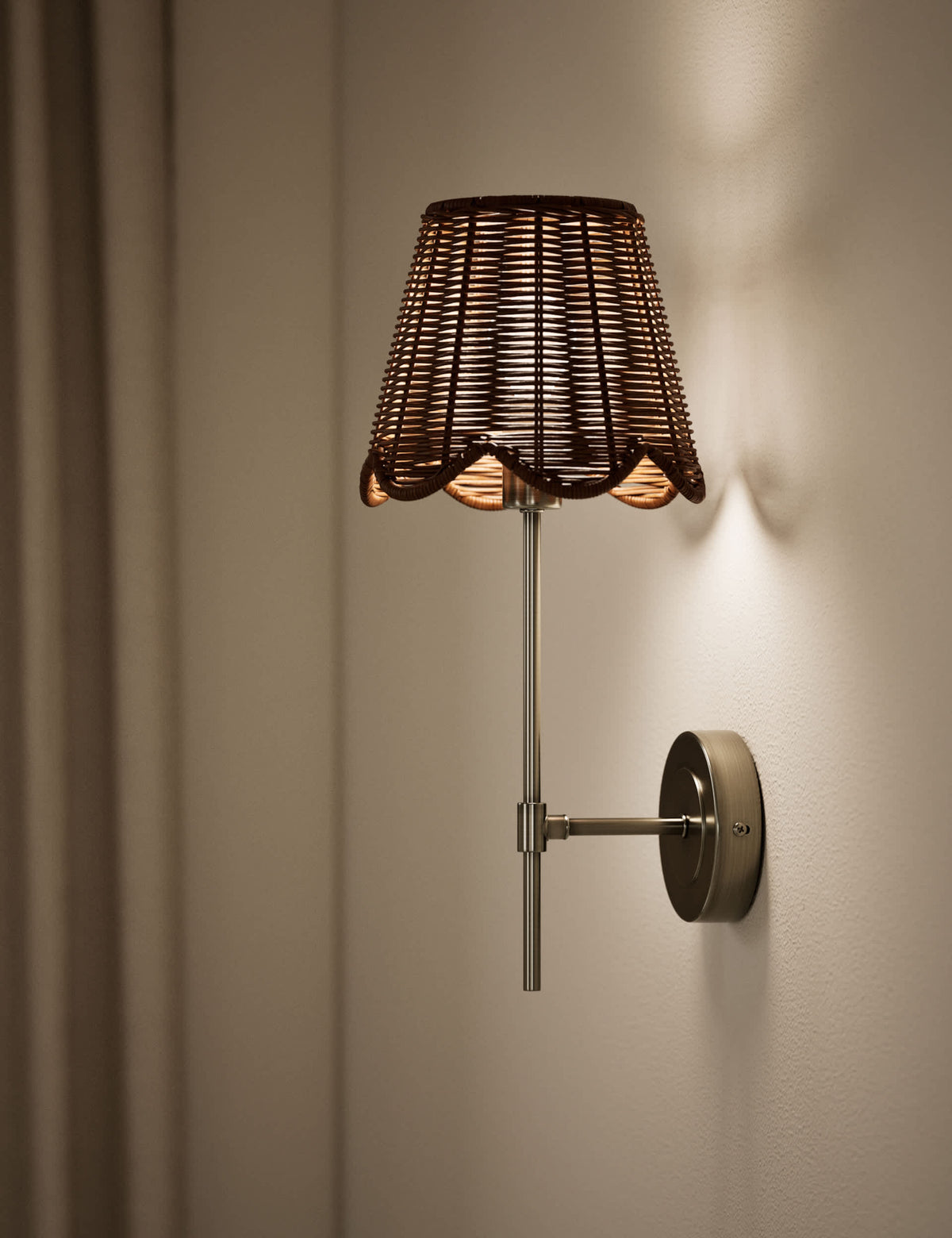 Wicker scalloped wall light with antique brass finish, UK version