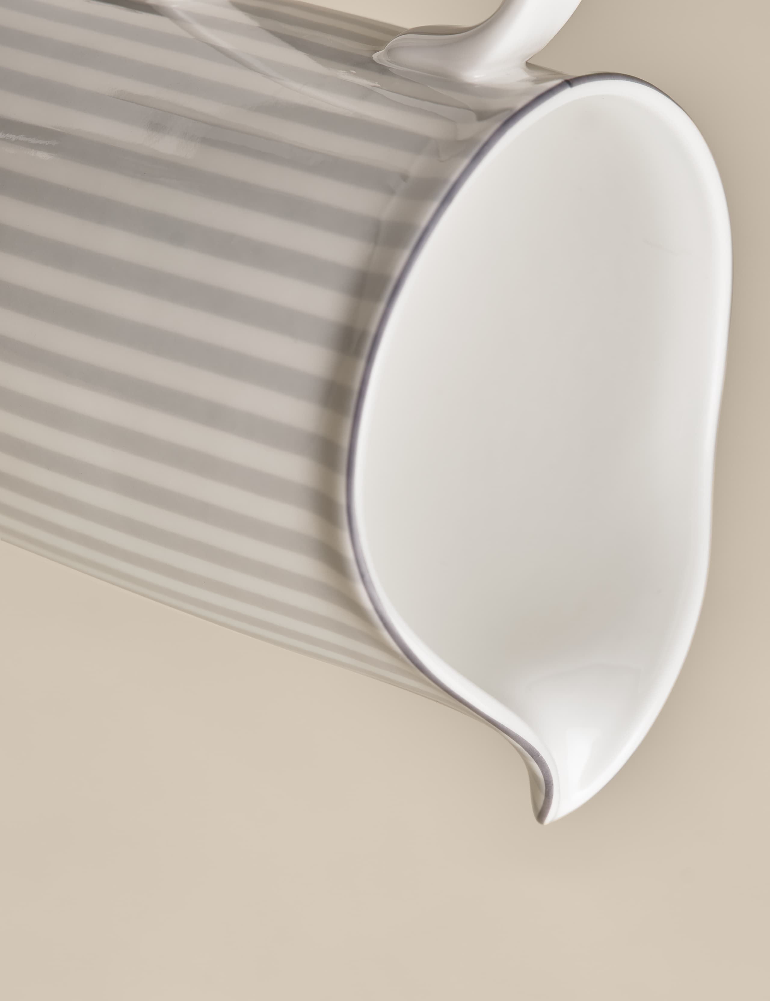 Hampton milk jug with gold-tone trim on china, UK version