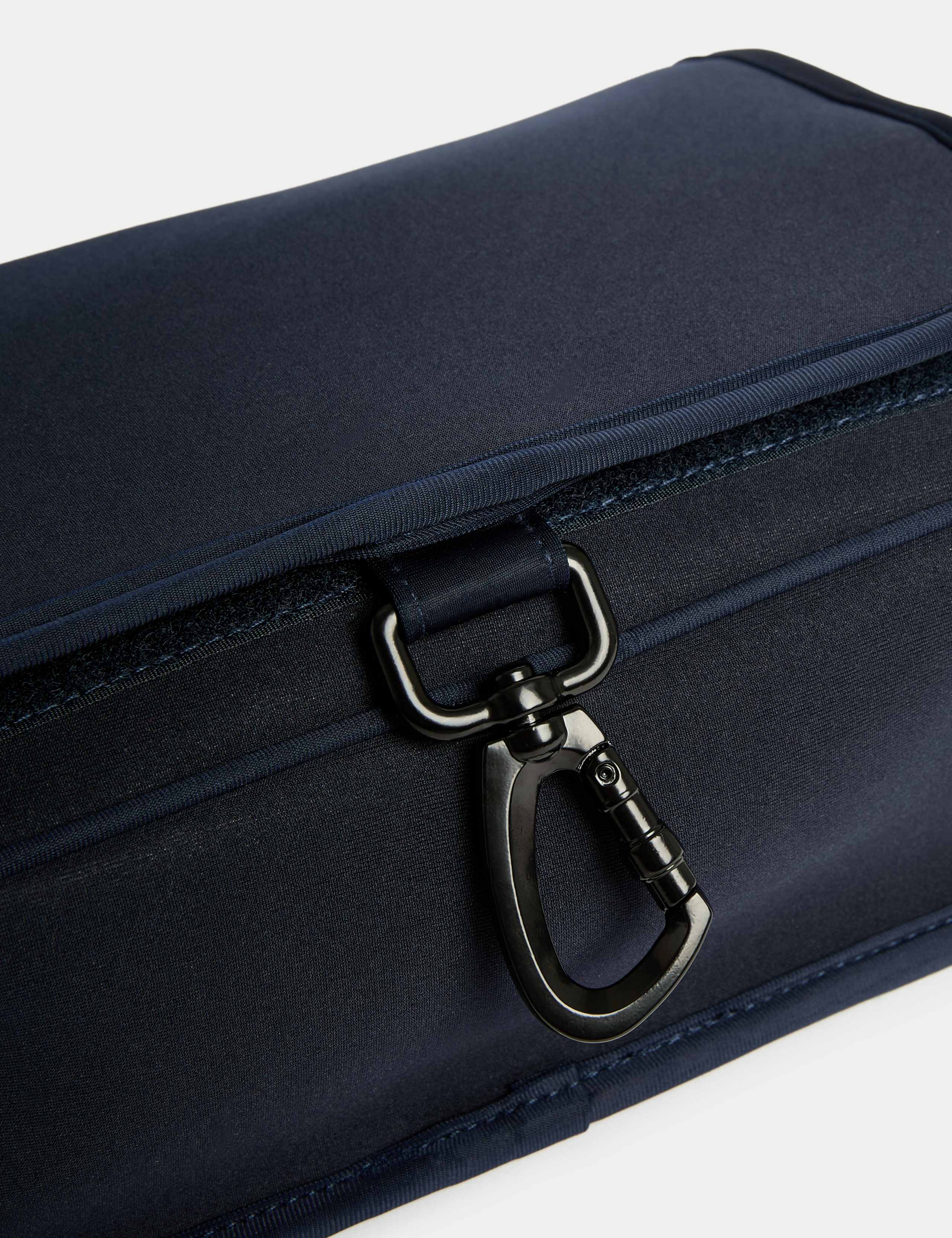 Hanging toiletry bag with mesh pockets and hook, imported from the UK