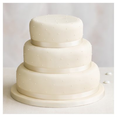 Waitrose three-tier golden sponge wedding cake, imported from the UK