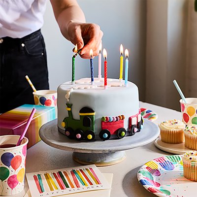 Waitrose train cake with blue icing and chocolate beans - British product