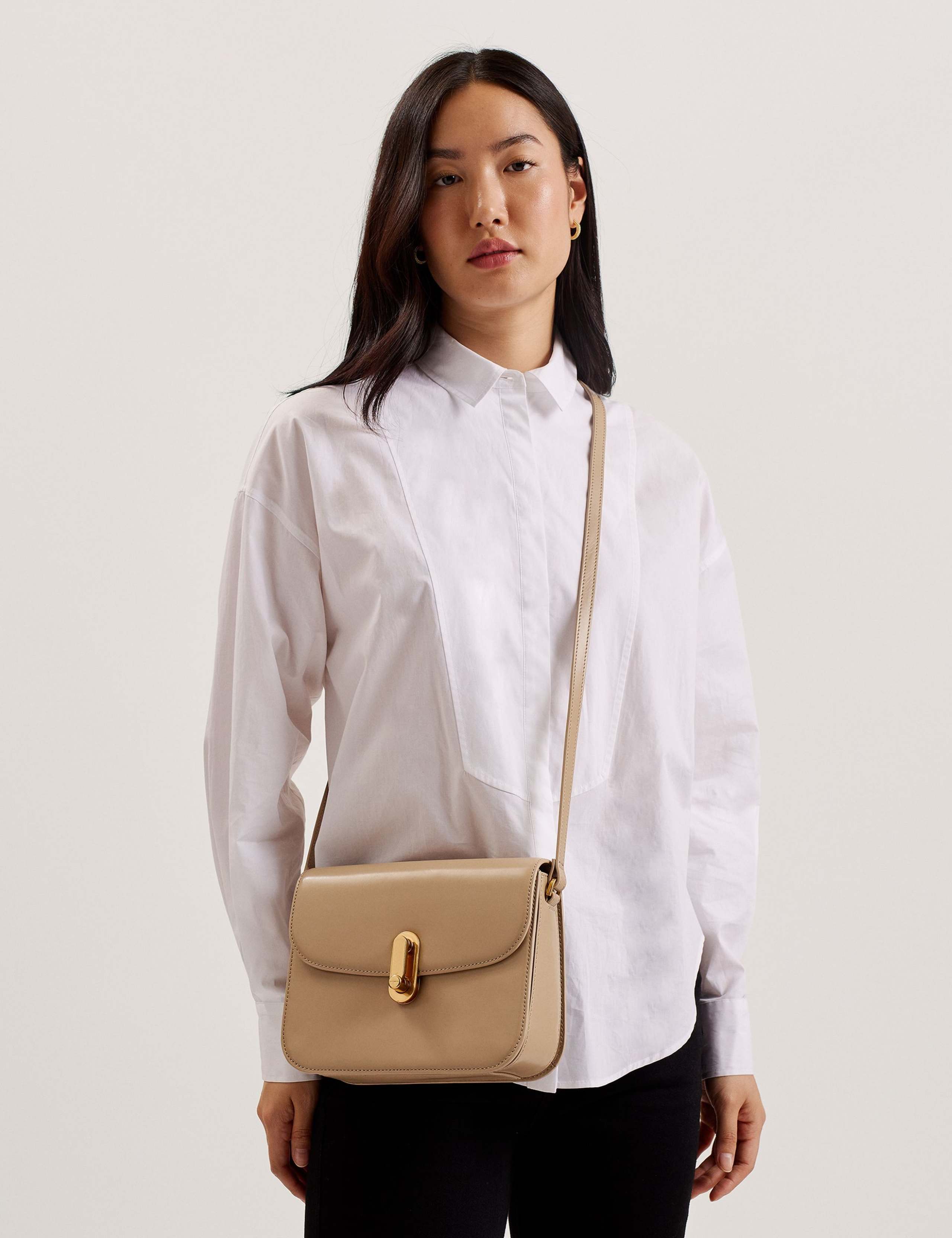 Ted Baker leather cross body bag with gold hardware, imported from the UK