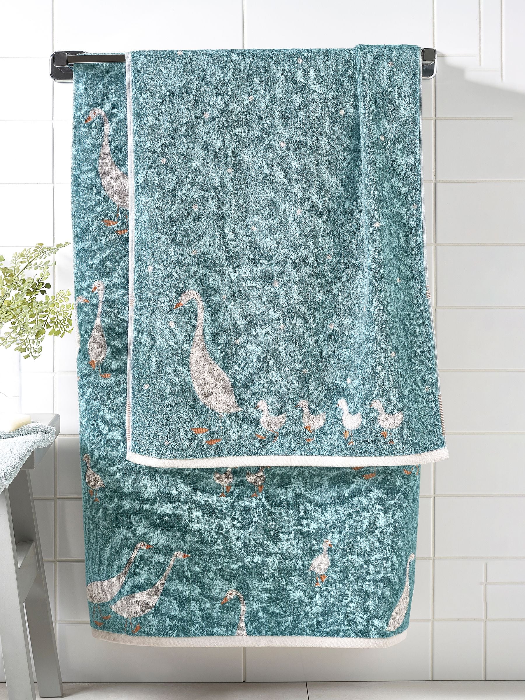 Teal blue cotton towel with geese design, UK version