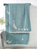 Teal blue cotton towel with geese design, UK version