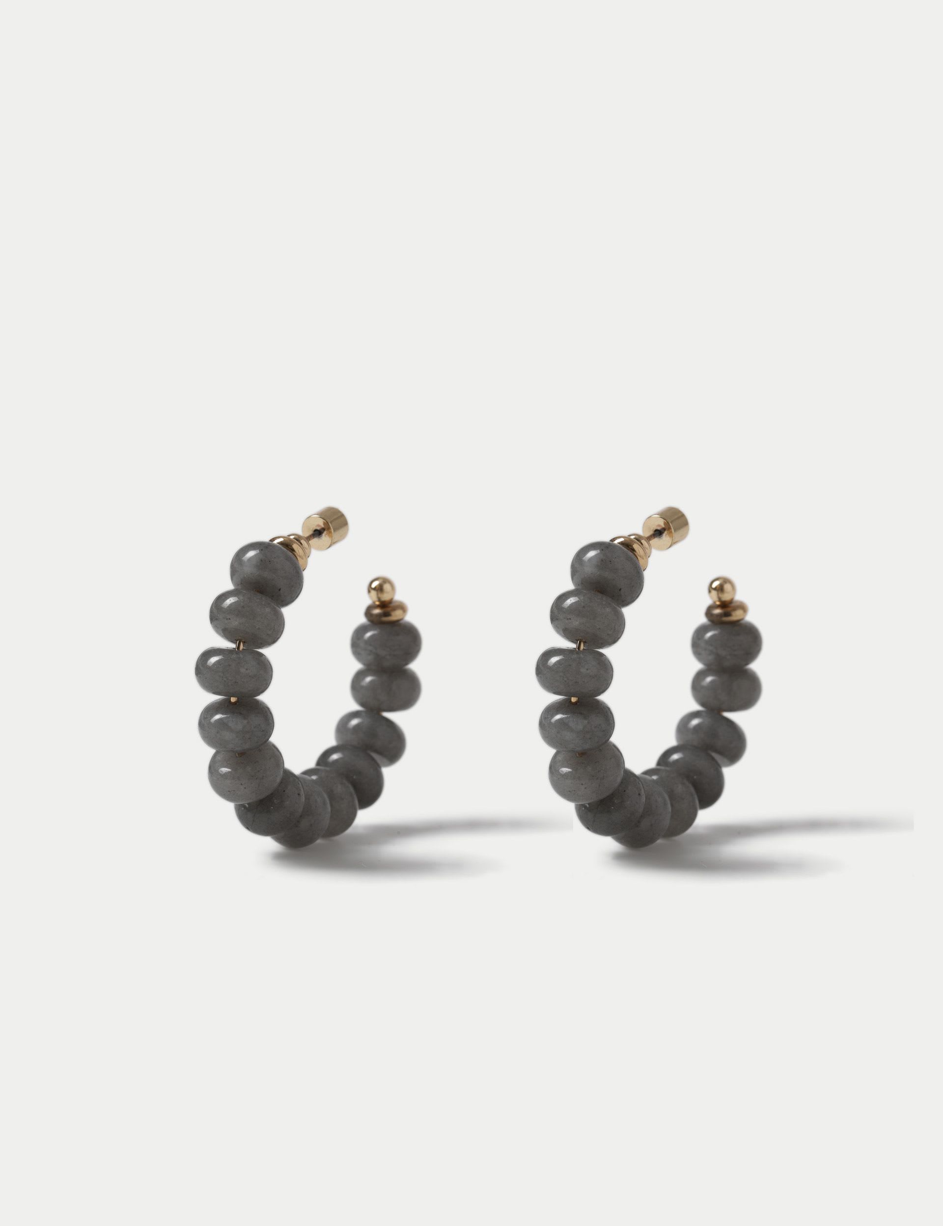 Faceted natural stone hoop earrings with iron accents, imported from the UK