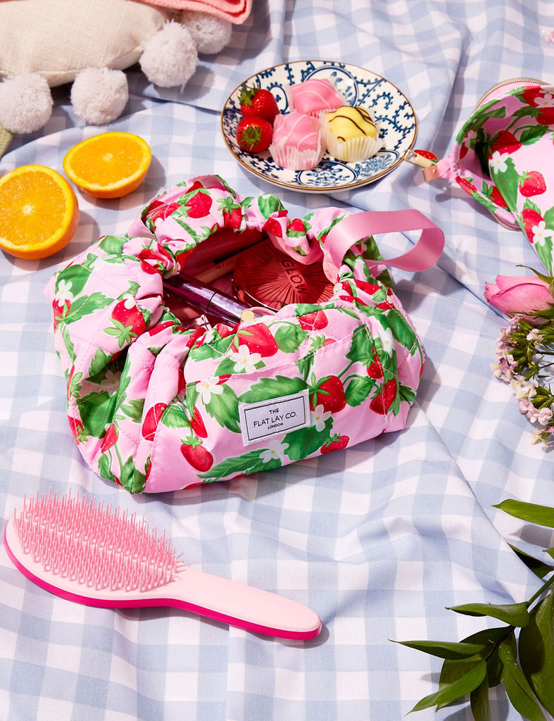 The Flat Lay Co. Drawstring Makeup Bag in Summer Strawberries