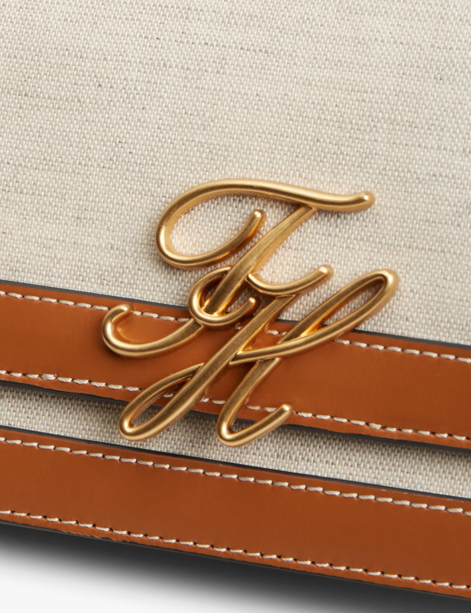 Tommy Hilfiger Script Canvas cross body bag with leather trim, UK version