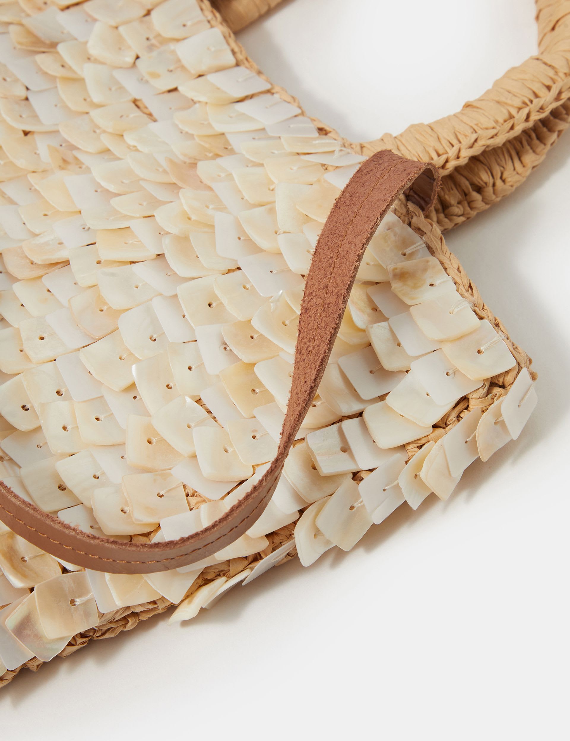 Accessorize straw embellished grab bag with raffia and mother-of-pearl, imported from the UK
