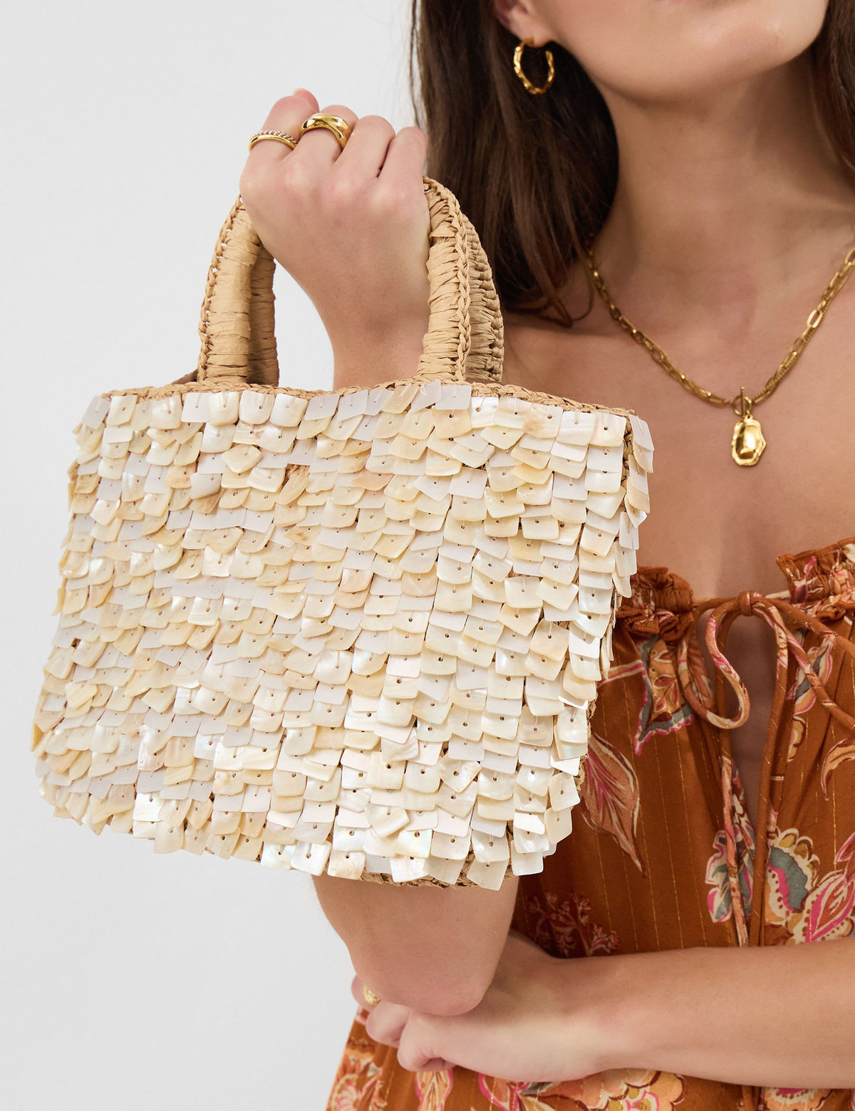 Accessorize straw embellished grab bag with raffia and mother-of-pearl, imported from the UK