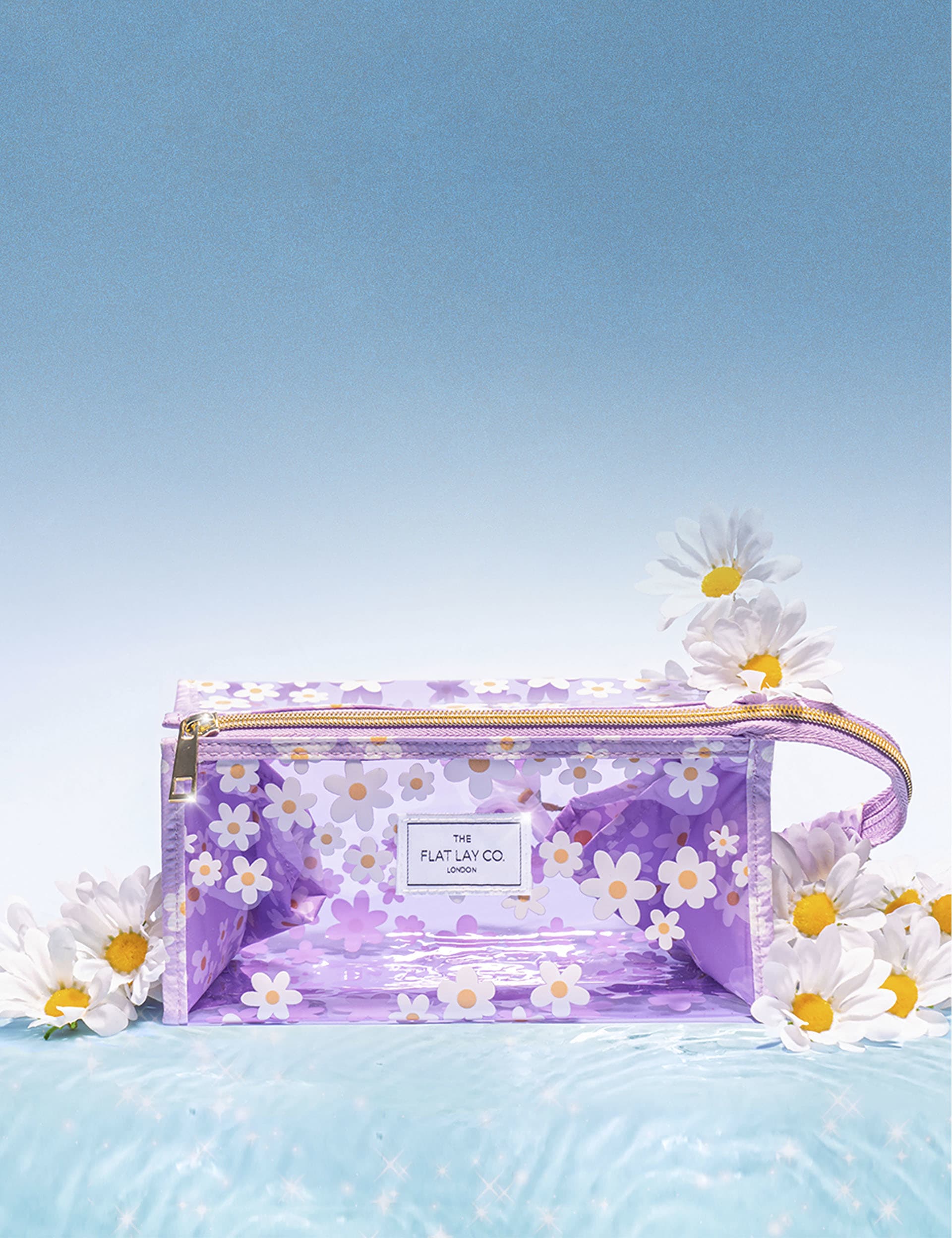The Flat Lay Co. makeup jelly box bag in lilac daisy imported from the UK