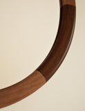 Marlowe round wall mirror with two-tone wood frame, imported from the UK