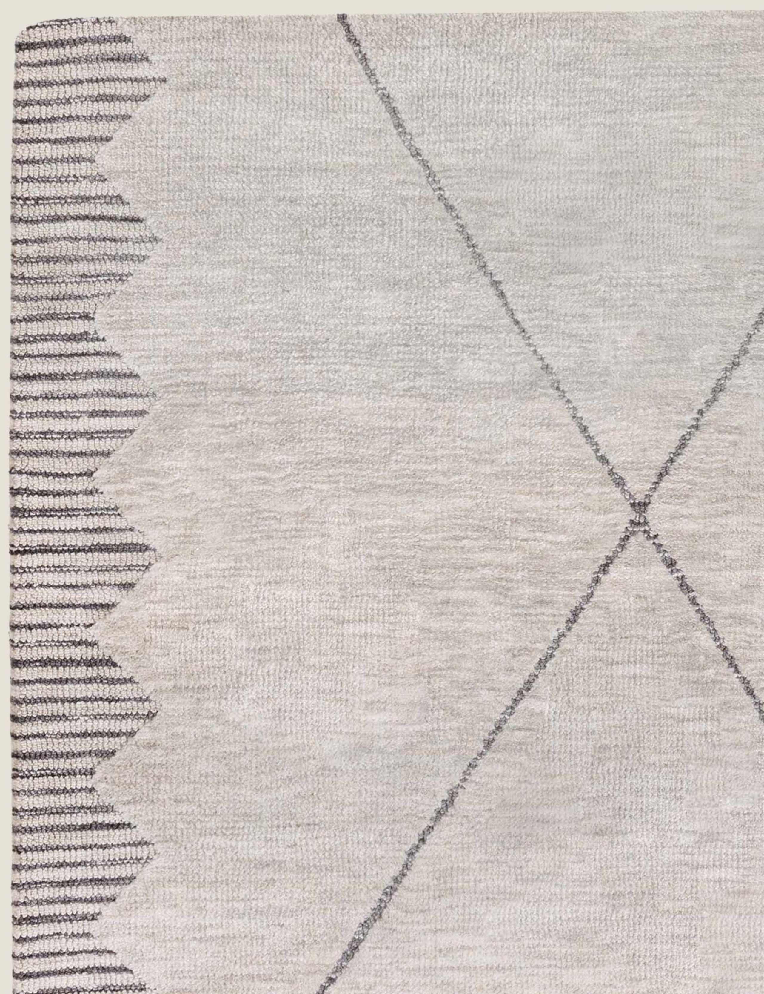 Asiatic Mason rug with bold zig-zag border, imported from the UK