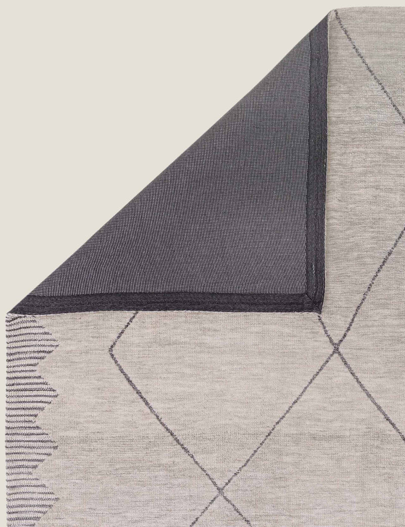 Asiatic Mason rug with bold zig-zag border, imported from the UK