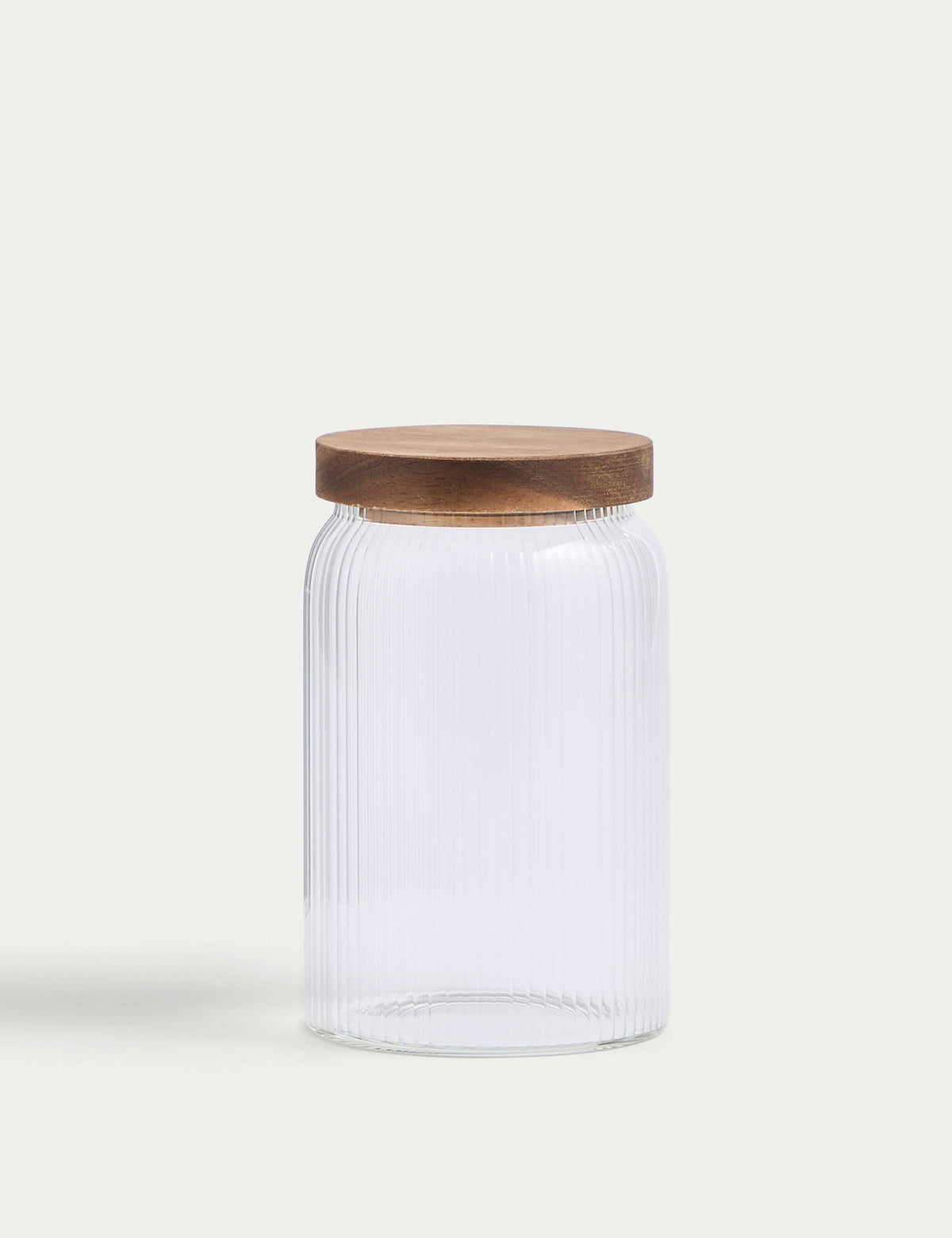 Medium ribbed glass storage jar with wooden lid, 16cm tall, imported from the UK