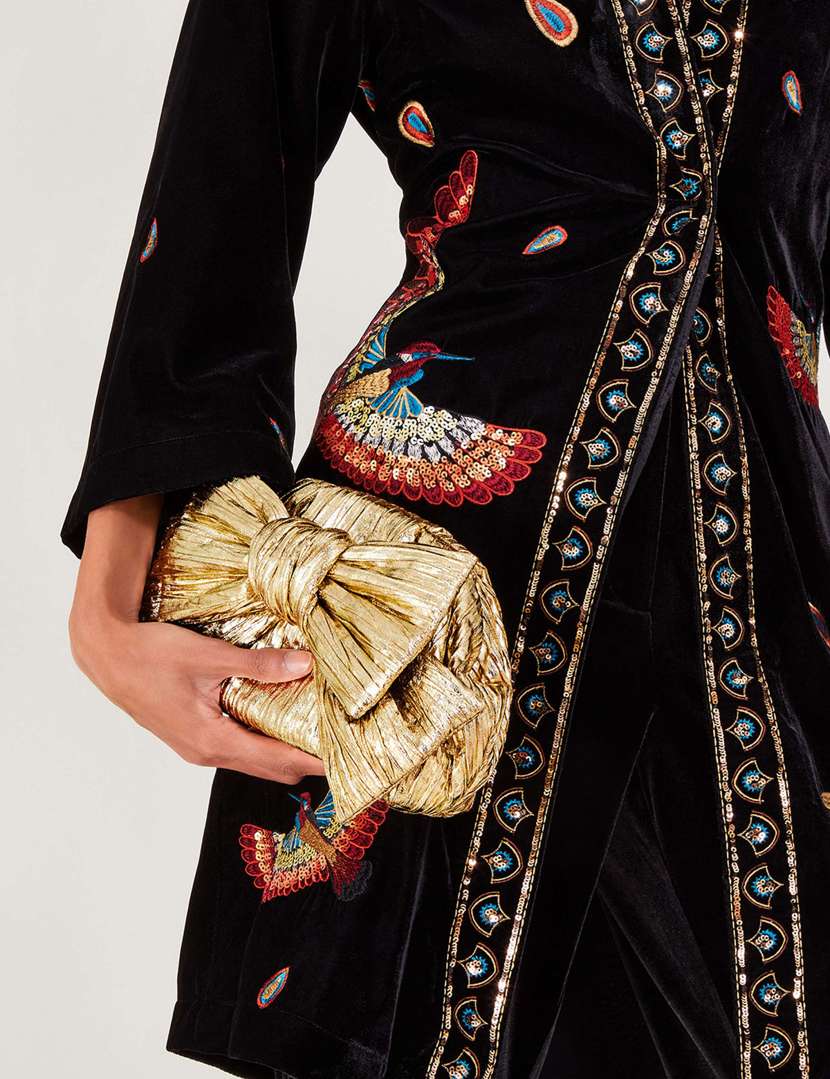 Monsoon metallic bow clutch bag, imported from the UK