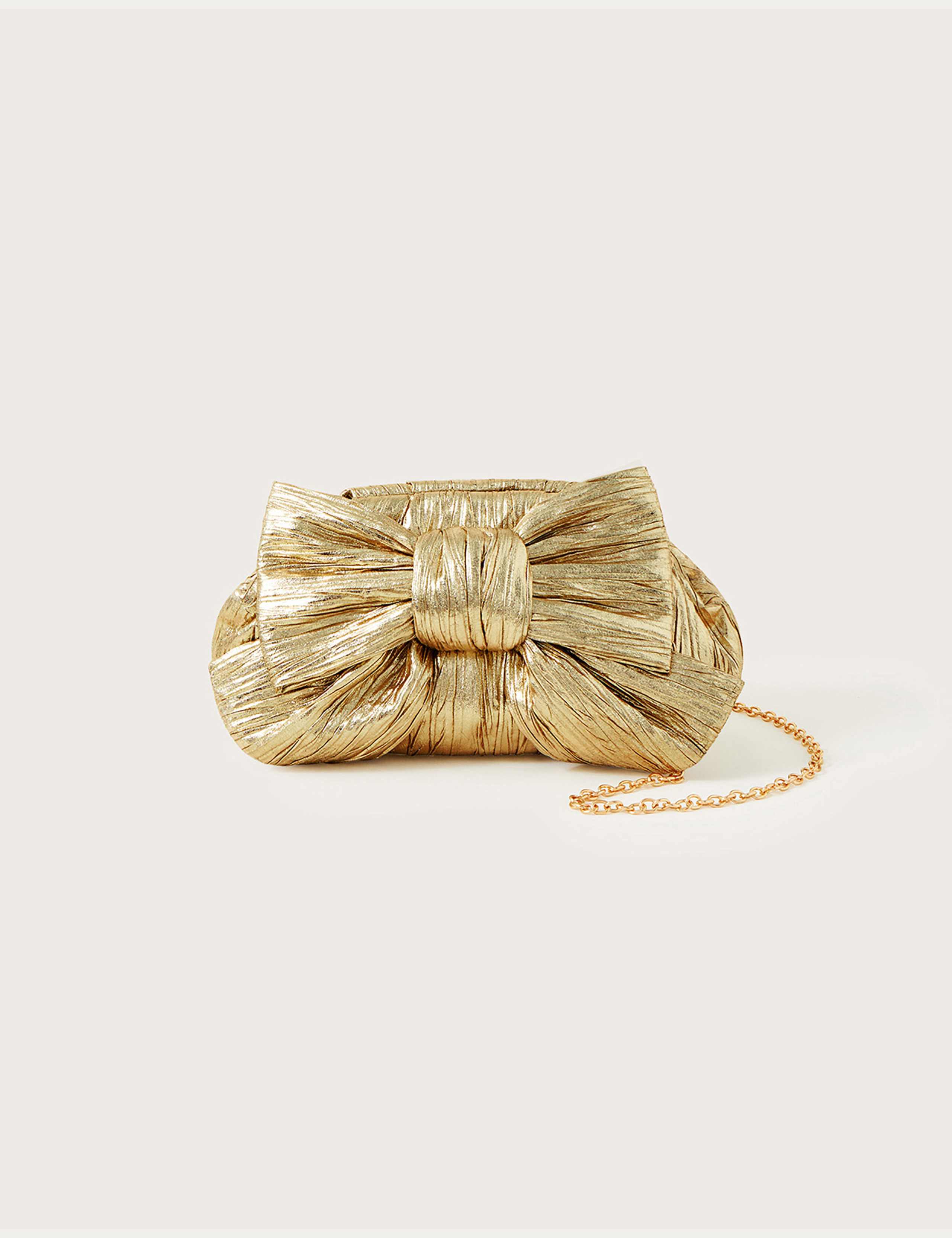 Monsoon metallic bow clutch bag, imported from the UK