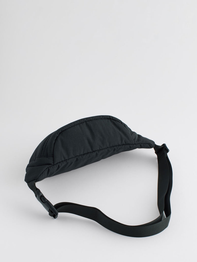 Black cross-body bag with nylon shell and polyester lining, UK version