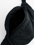 Black cross-body bag with nylon shell and polyester lining, UK version