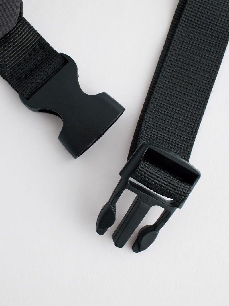 Black cross-body bag with nylon shell and polyester lining, UK version