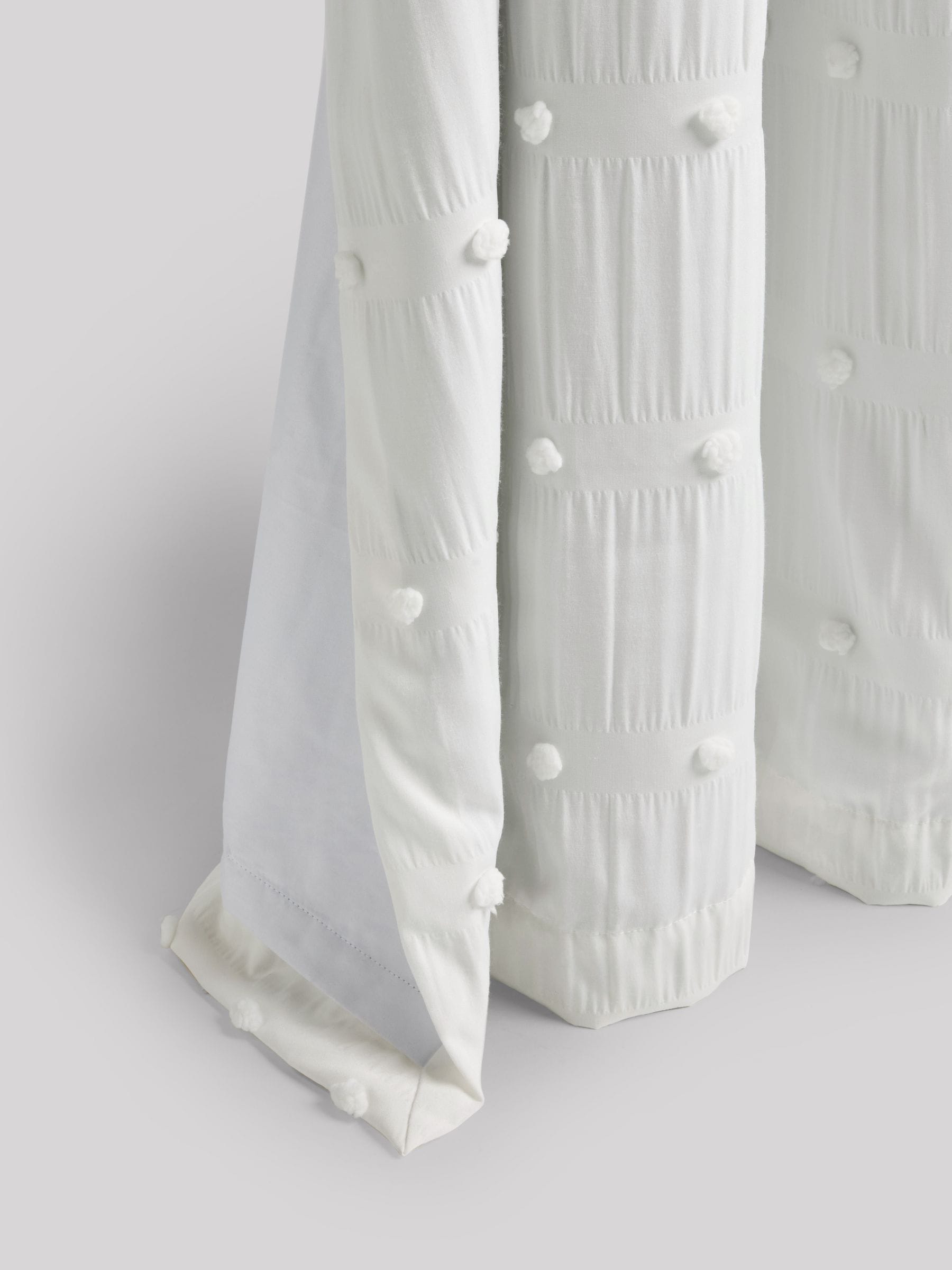 White bobble blackout curtains with eyelet fixture, UK version