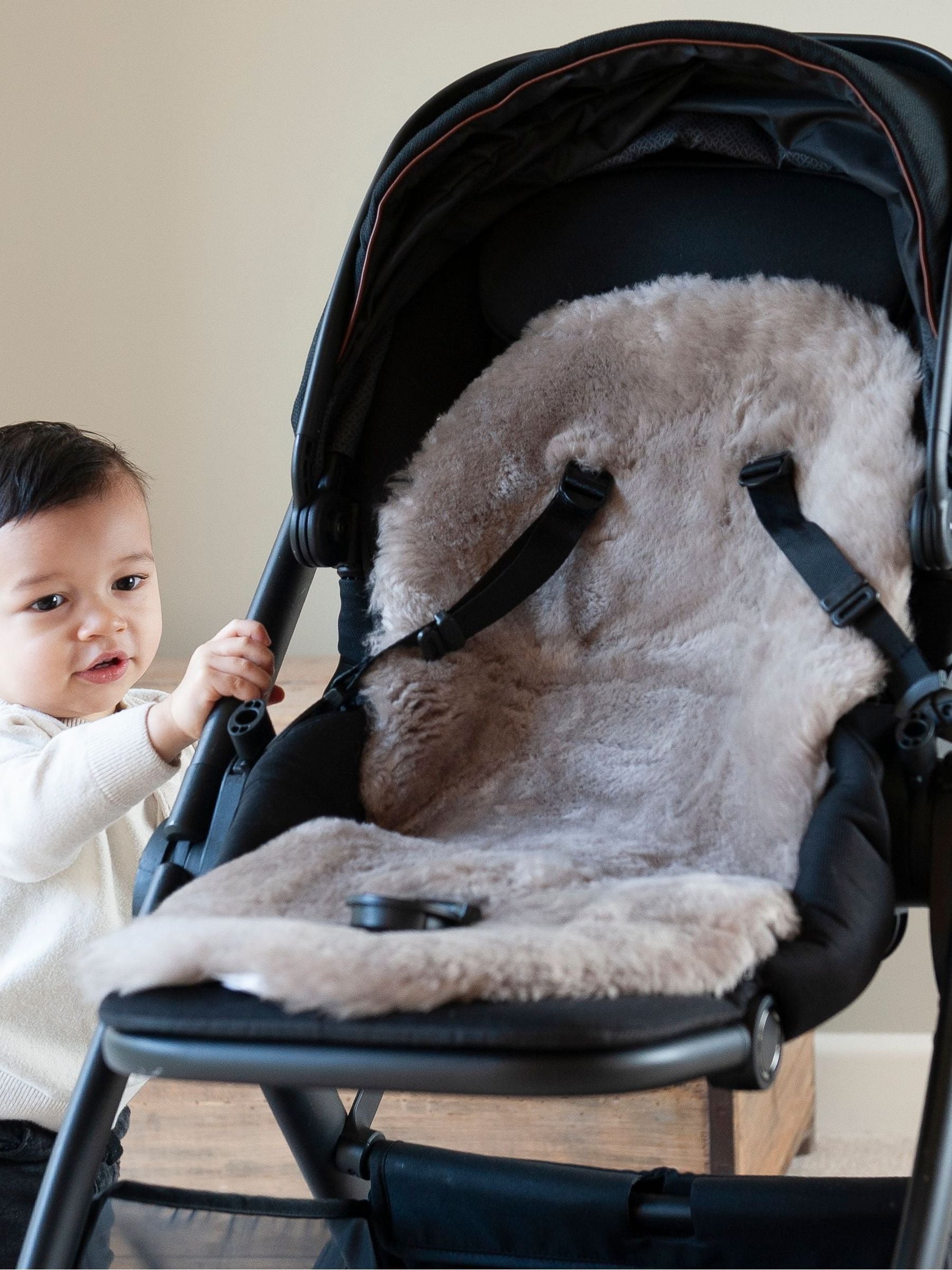 Naturally Sheepskins taupe baby pram liner, imported from the UK