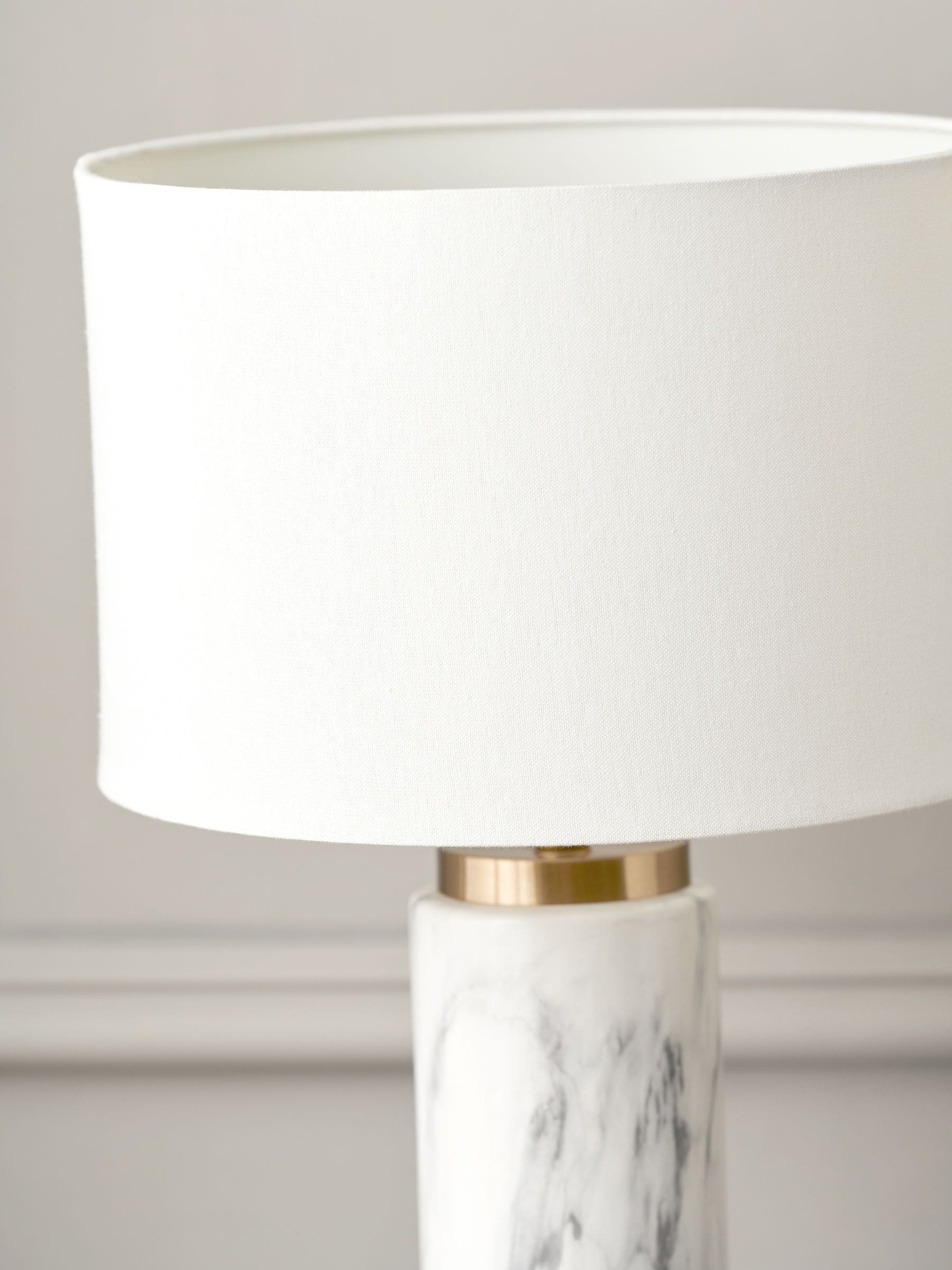 Pacific white Carrara marble effect ceramic tall table lamp, imported from the UK