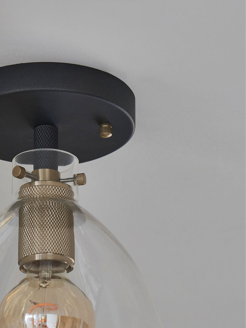 Black flush fitting ceiling light with brushed brass accents, 25.5cm height - British product