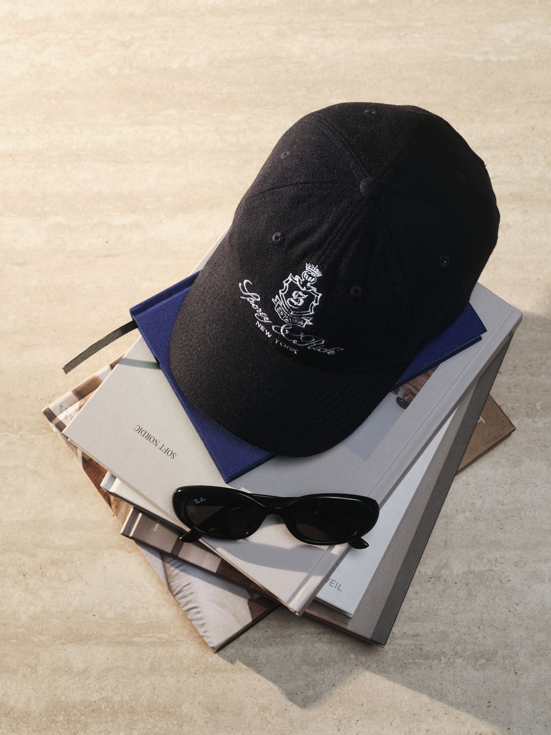 Sporty & Rich navy Vendome wool hat, imported from the UK
