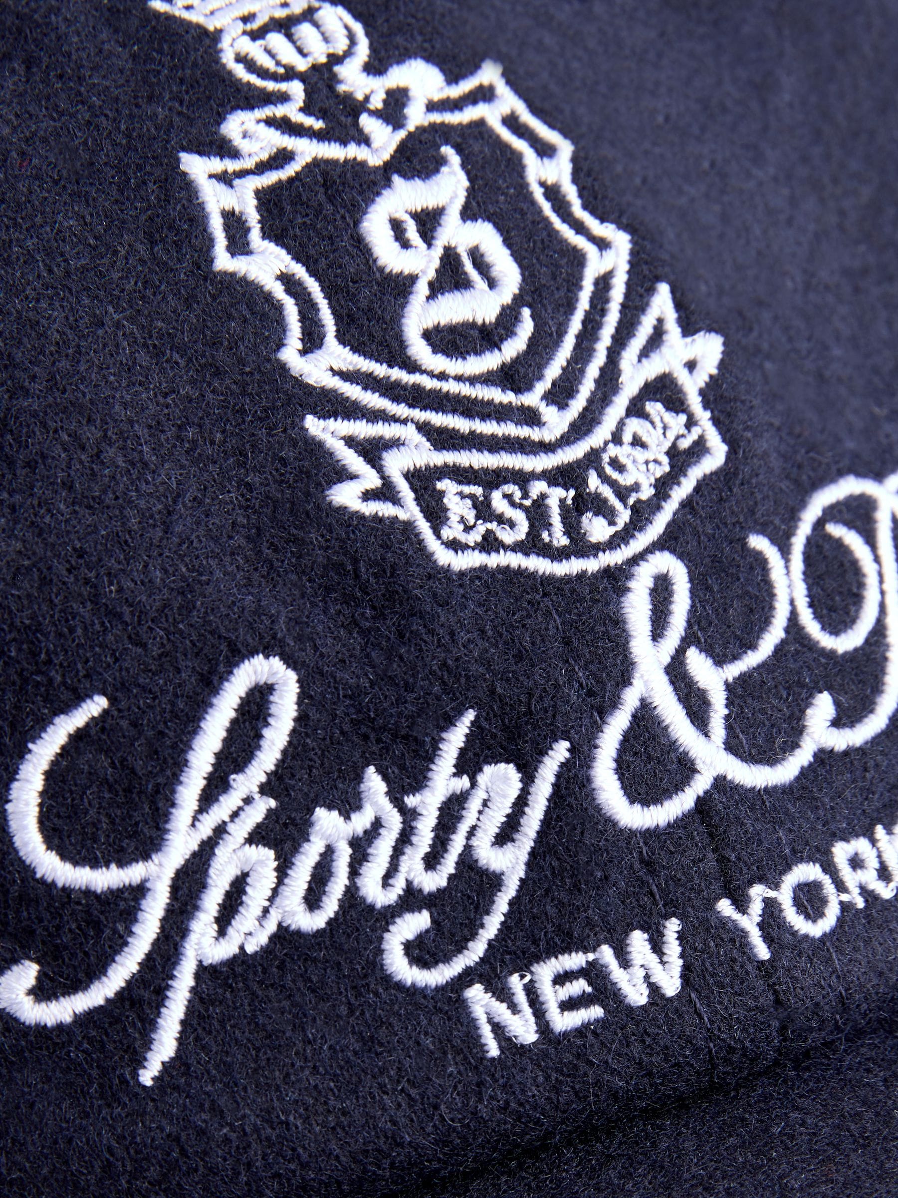 Sporty & Rich navy Vendome wool hat, imported from the UK