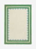Joules sage green wool rug with scalloped border, imported from the UK
